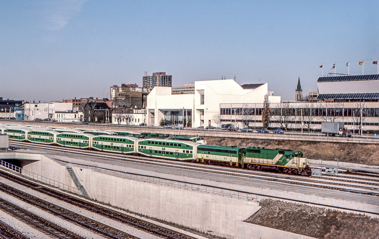 GO 725 and GO 802 are on a GO train in Toronto. Their train and other GO trains appear to be stored awaiting their call to Toronto Union Station and the homeward rush later in the day.