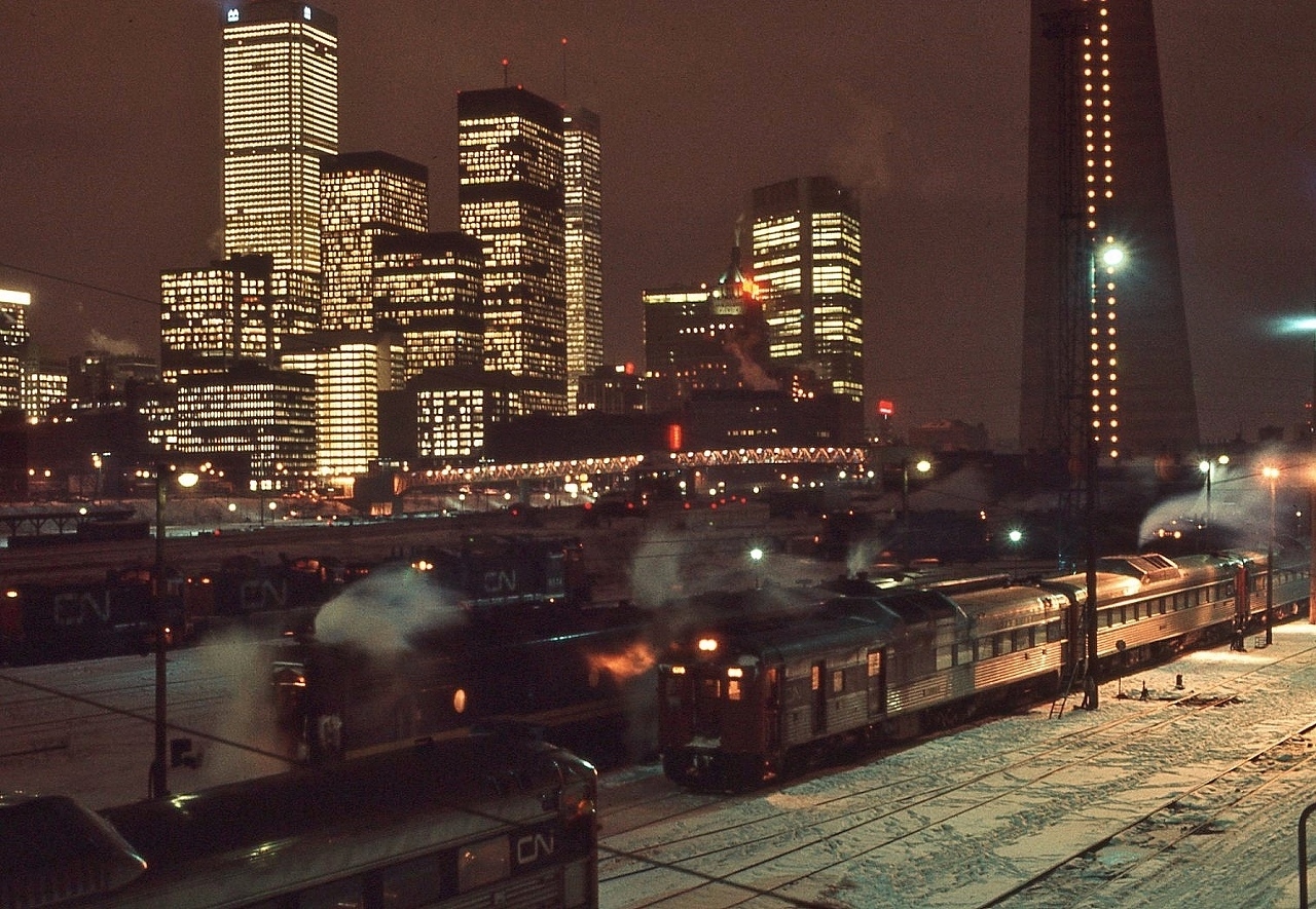 The north east view from the Spadina Bridge....Budd cars and S-13 switchers ( 8500 series)....everywhere !


   Nevertheless …. one of my favourite places....even on a frigid finger freezing Friday evening


   CN Spadina, December 17, 1976 Ektachrome by S.Danko


   interesting: today those bank towers are a lot older ….than you would believe.