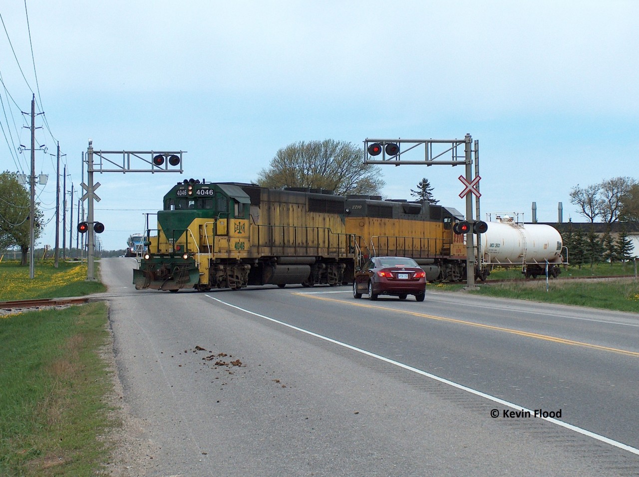GEXR 4046-LLPX 2210 are pictured southbound from Elmira with one tank car in tow crossing Highway 86.