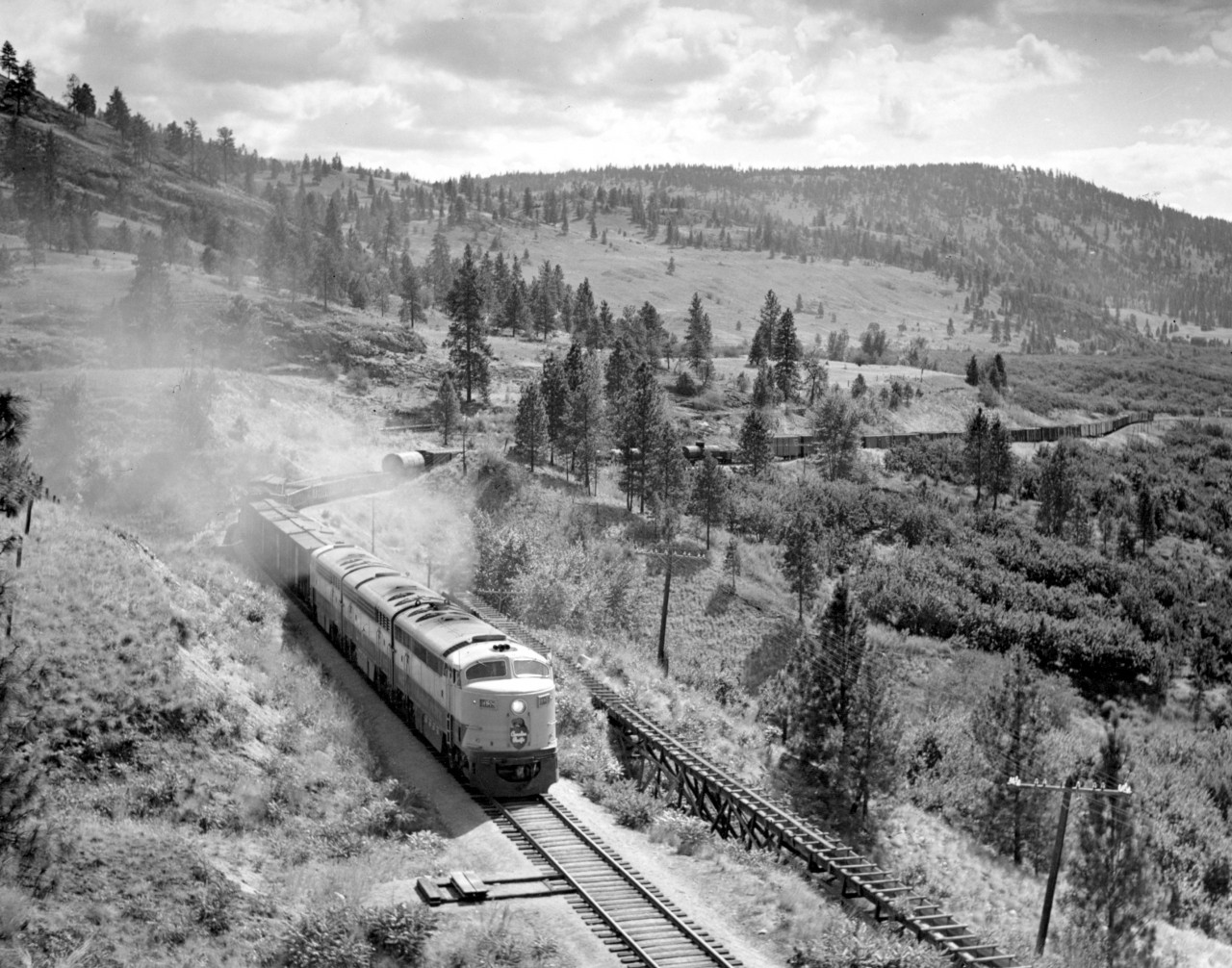 CP 4065 east at Arawana on the Carmi sub. about 5 miles east of Penticton.  Train was crawling up the 2.2% grade at about 8 miles per hour.  My dad remarked he could hear the engines working for an hour before it got here.  It sounded like a tug boat on the lake at first.  Note irrigation ditch to right of track.