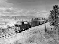 Caboose of eastward train in previous photo.  Brakeman was shouting something to photographer as he went by.  This location is 375 feet above Penticton, 3.5 miles west of Arawana and 4.5 miles east of Penticton.  About 10:30 am