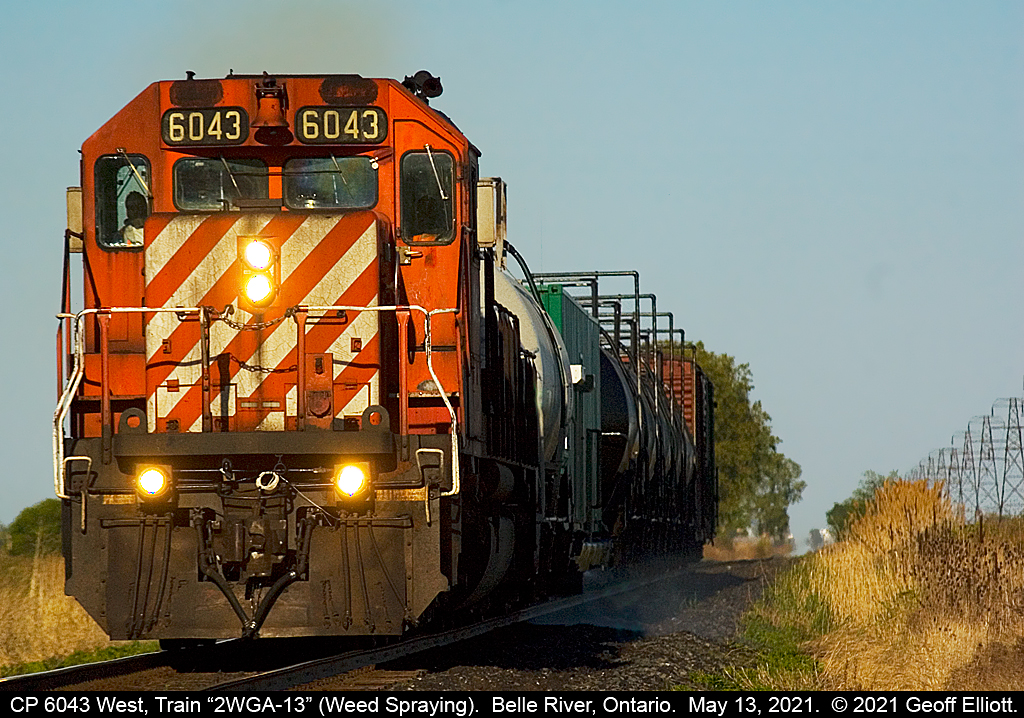 CP ran 6043 West, Train “2WGA-13”, or 'The WEED Train" on both the Galt and Windsor Subs on May 13th.  Sadly, by the time it reached Belle River in the evening the light was almost straight down the tracks so this is the best I could do with it.  Belle River, Ontario.  May 13, 2021.