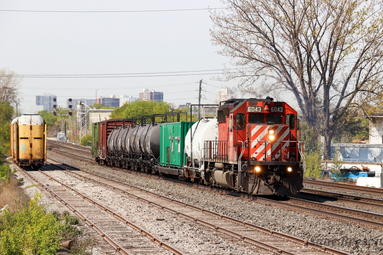 The CP weed sprayer train is seen entering Toronto with a deadhead move from Welland. Veteran SD40-2 6043 leads, pulling 9 cars. After missing out on the spray train over the last few years, it was nice to finally shoot (and chase) the Canadian Pacific Vegetation Control train.