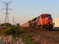 CP 2-241 races through the Hornby dip with 2 CN Gevos for power and a friendly engineer at the helm. 100 empty autoracks is no problem for the ET44AC/ES44AC pair as they reach speeds of 40MPH coming out of Mississauga and entering Milton. This train had originated in Montreal as a 9-119 so I was suprised when I saw them lined to Guelph Junction. To top it all off, an annoying cloud had lifted about 15 minutes prior, giving way to the setting sun and my favourite kind of light: golden. 