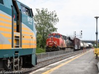 As eastbound VIA #24 unloads passengers CN 377 departs for Toronto.