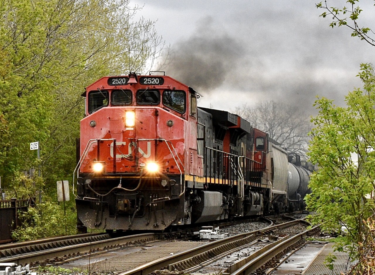 CN M323 hauls 11 cars through Pointe-Saint-Charles with a rare C44-9WL, a dash 9 with a Canadian cab.