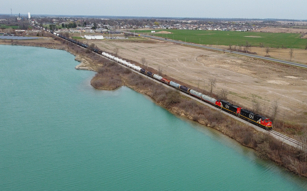 An often forgotten part of the local Hagersville History is that the town built itself around the rock quarries that first began being mined in 1888.  They were served by the Canada Southern and CN rail lines that passed through the town.  Today they are flooded with water and private property.  Pictured is CN 402 passing by one of the flooded quarries off of Sandusk Road, the town of Hagersville is visible in the background.