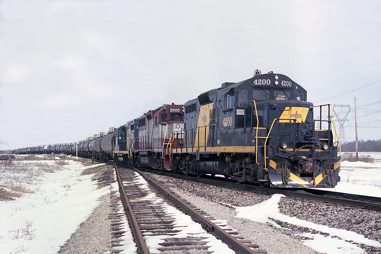 This division of RLK-Southern Ontario had only been in business about 6 months when I shot this image. So it explains the mish-mash of power for the Nanticoke road train. Seen are RLK 4200, RLK 2000 and TOR 1751. The TOR refers to the previous name  "Trans-Ontario Railway Company".  The 4200 has been scrapped. Not sure of the other two.