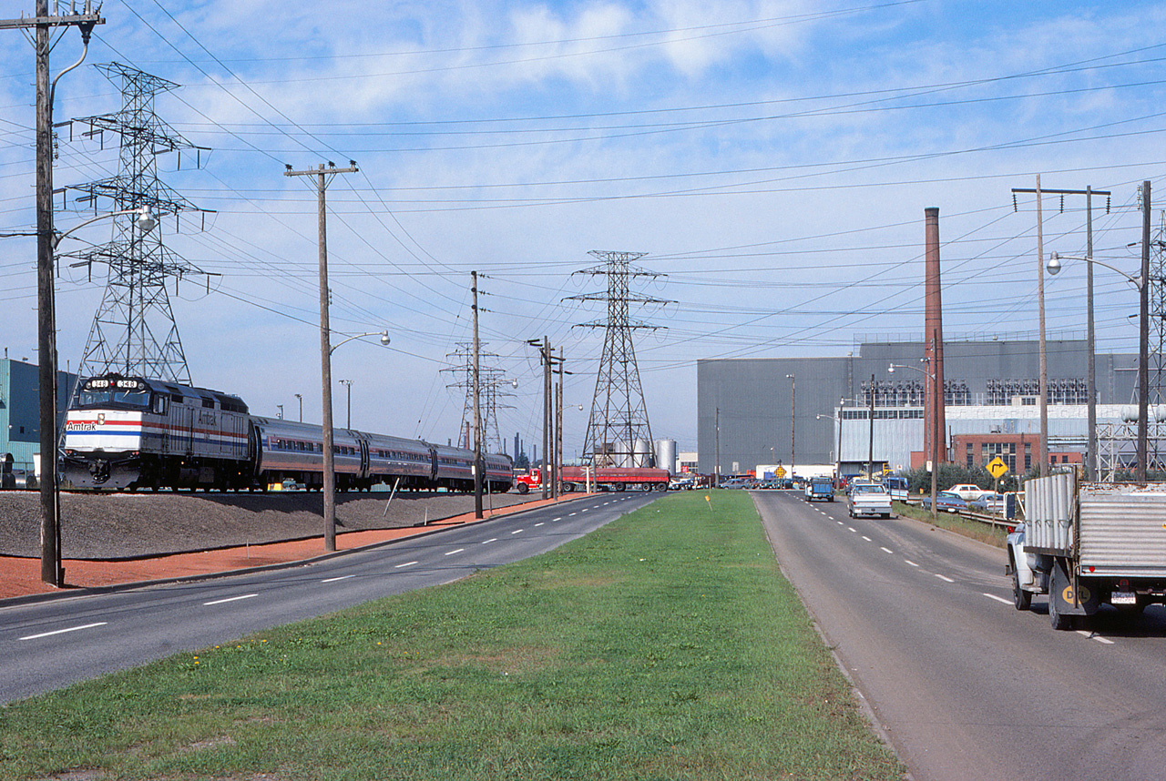 The  Amtrak rare mileage tour  continues. The "Maple Leaf" has almost completed its detour over the N&NW spur, and will rejoin the Grimsby Sub in about half a mile. This shot is another interesting "then & now" comparison of Hamilton's industrial scenery.