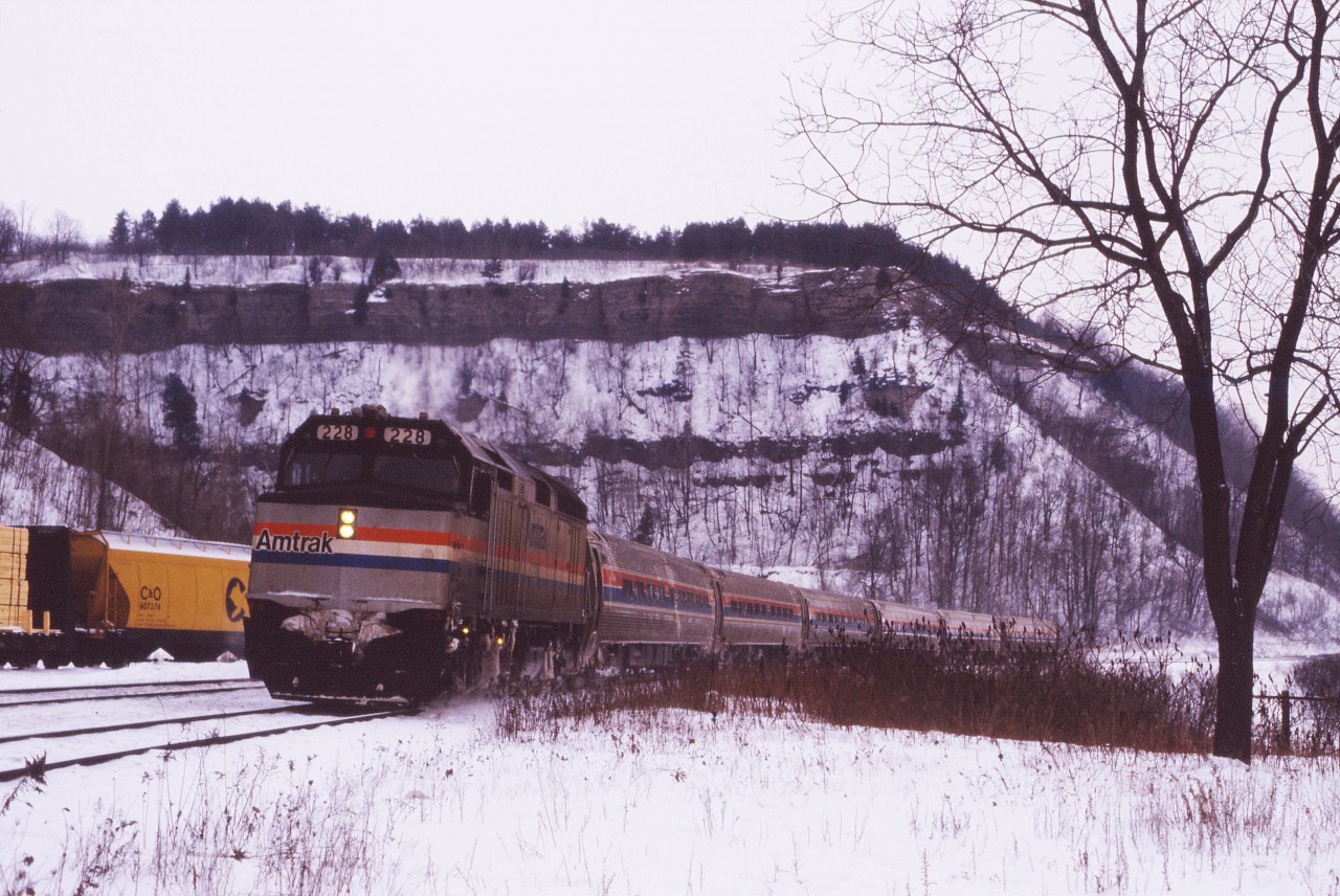 From its inception on October 31, 1982 until January 14, 1990 joint VIA-Amtrak train the "International" ran over CN's Oakville and Dundas subdivisions to London. Originally, Amtrak's "Blue Water" terminated in Port Huron, Michigan and after the successful introduction of the New York-Toronto "Maple Leaf" in April 1981, Amtrak and VIA came to an agreement for a jointly operated train. Re-routing over "the back route" through Guelph and Kitchener at the time of the 1990 VIA cuts added an hour to the schedule and then the discontinuance of on-board U.S. Customs inspections at Port Huron after the September 11th, 2001 terrorist attacks made the trip even less attractive. (Passengers had to board buses and clear customs at the Bluewater bridge for six months.) Initially, VIA and Amtrak provided equipment for one of the two train sets which evolved to a VIA locomotive and Amtrak cars both ways in the mid-1990s (single level until November 1995 and Superliner equipment--occasionally replaced by Horizon cars--thereafter). At the end, Amtrak was providing both the locomotive and cars in both directions. The last westbound "International" ran on April 23, 2004.