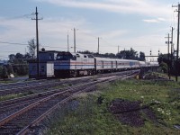 One of Amtrak's trains with an "on again, off again" history is the Montrealer. Initially begun in 1972 (first southbound trip was September 30th), the train was suspended between April 1987 and July 1989 due to slow timing over Guilford track. Once restored, it ran on its overnight schedule for almost another six years before changed to a day train and originating at St. Albans, Vermont on April 1, 1995. Apparently the Montrealer was the first train to use Amtrak on-board personnel because there weren't any holdover staff from its private railroad predecessor. Here we see the southbound train making its first stop on its way to Washington at the Montreal suburb of St-Lambert behind F40PH 404.