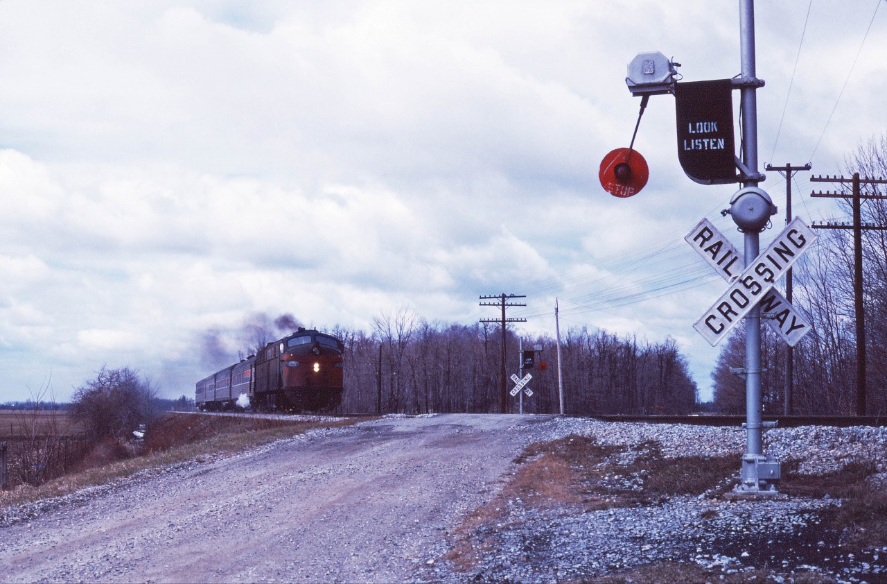 Even in 1978, the crossing protections on Penn Central's Canada Division were unique. So, please forgive the somewhat distant train--I wanted to make sure that I caught the "wig-wag" in the photo! Detroit-Buffalo train 64, the "Niagara Rainbow" somewhere east of St. Thomas behind a former Milwaukee Road E9. (Can anyone out there properly identify the location?)