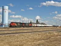 CN M 31341 29 rolls through the small prairie town of Viking, on the busy Wainwright Subdivision.