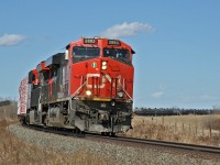 CN X 31651 30 rolls through a sweeping curve just west of Shonts, Alberta