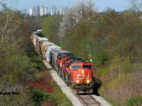 CN L568 is on its knees getting over 80 cars up the hill as it departs Kitchener, Ontario on the Guelph Subdivision heading to Stratford. The consist included; 5790, 4136, 7083 and 4790. May 20, 2020.