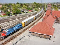 CN 8952, the GTW Heritage Unit leads train E271 through Brantford and past the iconic station which has ties back to the original Grand Trunk.