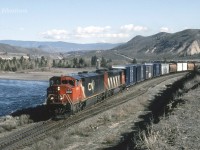 CN 2448 and 5536 are westbound at Basque on CNs Ashcroft Sub. There's a two way connection here between the CN Ashcroft and CP Thompson Subs. The crossover is used regularly due to directional running (since 1999) required to and from the coast via the Thompson and Fraser Canyons. This connection / crossover is listed as a directional running boundary. Eastbound routes beyond this point split up again at Savona and run either side of Kamloops Lake.      