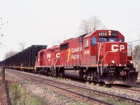 Definitely an interesting train for its time, CP train 142 originally 741 I believe was a unit train of truck frames that ran between a stamping plant in St. Thomas and the large General Motors plant in Oshawa. The loaded eastbound trip was certainly more photo worthy than its empty westbound counterpart. Unfortunately its relatively early morning run made it somewhat hard to get unless my work shift worked in my favour. Over the years the motive power changed from MLW slug sets, to GP9's, GP38's and GP40's. Sadly truck production ended GM years ago killing 142/141 in the process. Since then the GM plant has closed down completely and CP has spun off the St. Thomas subdivision to the OSR. This day CP GP40-2 4656 (ex Guilford/B&M) and a GP9U are in charge as they enter the double track CTC control at Guelph Junction.