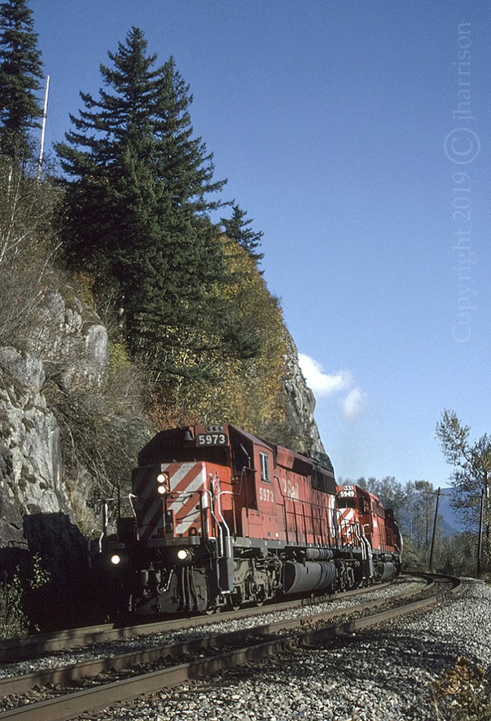 Westbound CP 5973 with trailing 5949 at Agassiz on CPs Cascade Sub. Both units are listed as: In Engineering Service (2018). Info: CPRDIESELROSTER.COM