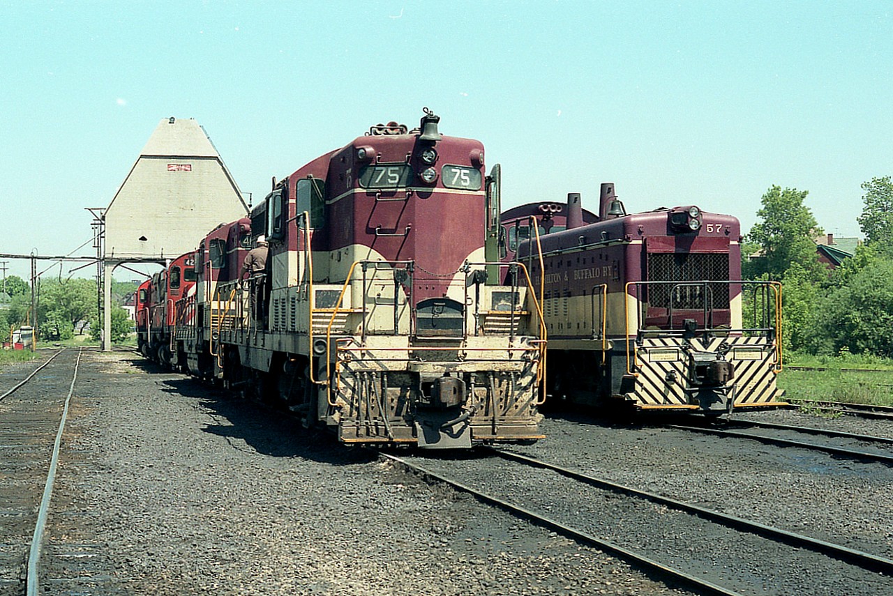 When there was nothing happening, or between the action thru Bayview; it was always a good idea to check out TH&Bs roundhouse and loco facility in Hamilton.  And there was always something to see.  This image, taken on a Monday afternoon, shows TH&B 75, 403 and CP 4226 among others. TH&B 57 is on the right, and I neglected to record any other units in behind. It must have been one of those "hurry in, and hurry out" kind of days.