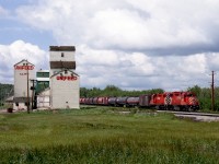 CP Halkirk turn out of Red Deer on the eastbound trip passes the elevators and feed mill at Clive. Tank cars are for the LPG plant at Nevis. Currently the line, once a major originator of coal, is abandoned east of Stettler