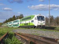 After departing Acton GO 10 minutes prior westbound GO train 3925 scoots across Wellington Road 29 approaching Guelph.
