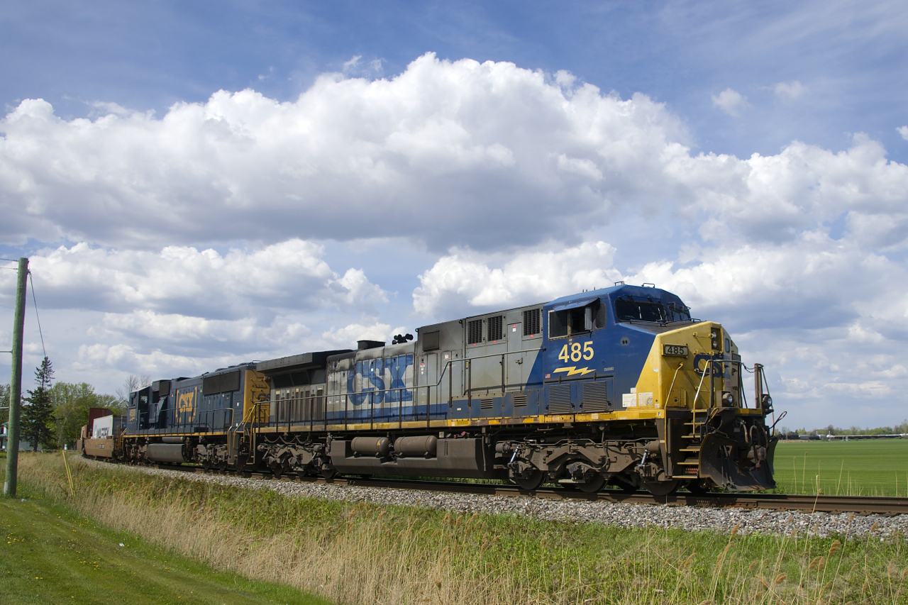 With AC4400CW CSXT 485 and rebuilt CSXT 4530 for power, CN 327 is rounding the wye that takes it from the Kingston Sub to the Valleyfield Sub. It will set off cars at Coteau before departing southwards.
