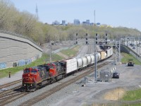 CN 2099 & CN 2678 are the power on a rare non-DPUed CN 305 as it leaves Turcot Ouest after chaning crews. CN 2099 has a battery box that likely came from an IC Dash8.