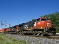 A 636-axle CN 120 has CN 2253, CN 8896 & CN 8825 up front as it heads east after working Taschereau Yard. Mid-train is CN 2308 and an inspection box car.