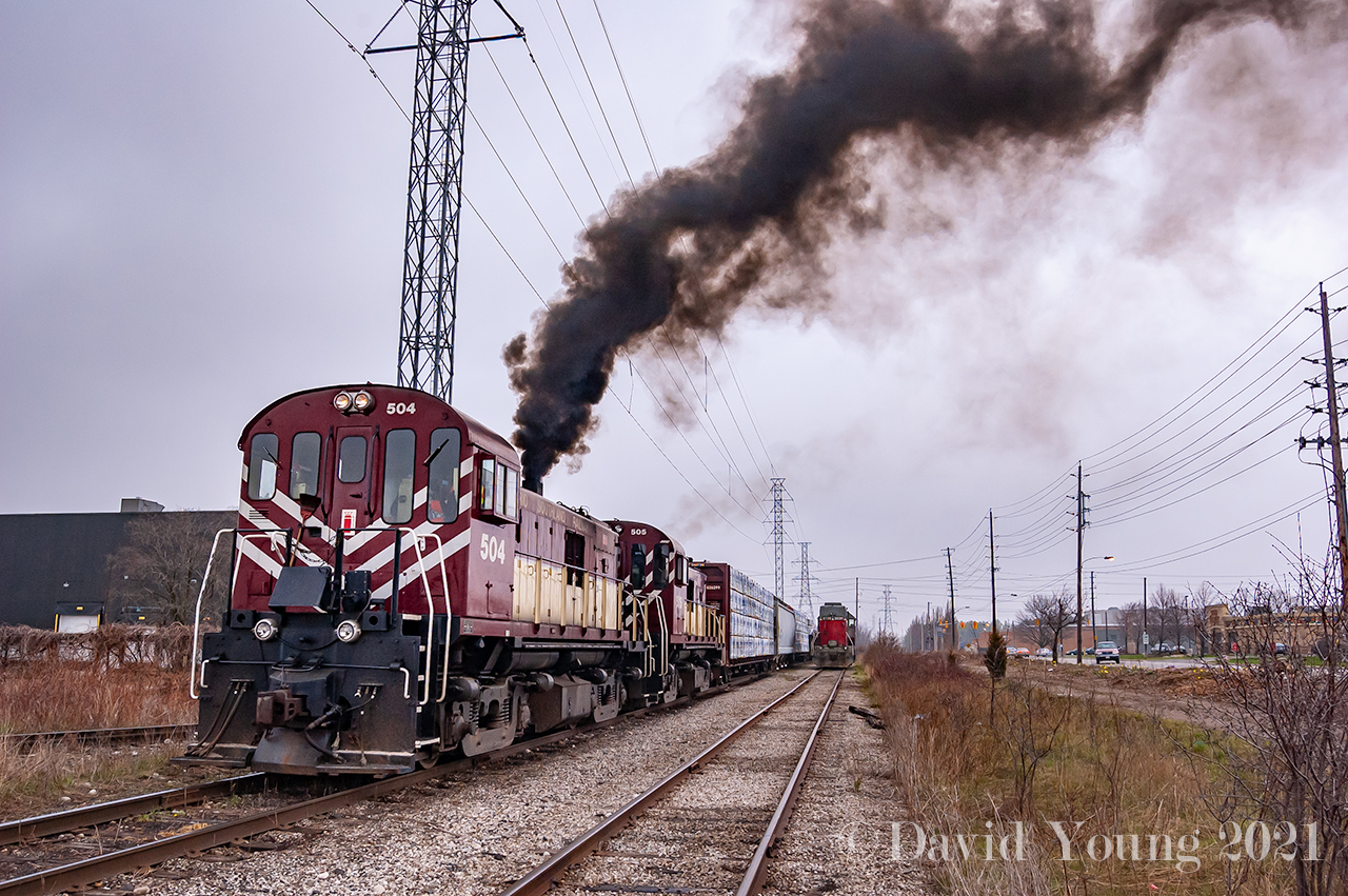 Ontario Southland Railway RS23's 504-505 display what MLW's are all about as they shove their southbound train north, out of the interchange on an overcast April day. Power from GEXR 580 sits parked at the north end of the interchange after the mornings events.

April 27th in 2007 was a day of drama for the operating railroads in Guelph. Earlier that day Goderich and Exeter freight 580 had derailed a mile or so south of the interchange after crossing Edinburgh Road for their final time. OSR ended up running down to the site to try and rerail one of the derailed cars unsuccessfully. They'd return to the interchange, wye the power and continue on with their day.