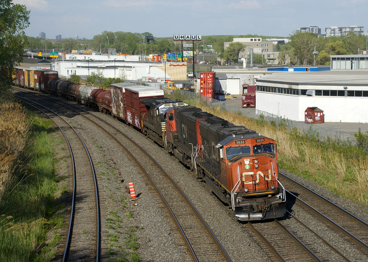 CN 527 has a long train as it heads towards Taschereau Yard with a pair of SD75I's and an NS unit for power (CN 5633, CN 5738 & NS 9932). The SD75I's had been on a CN 322 the week before and the NS unit was from a CN 529 which had terminated at Southwark Yard overnight.