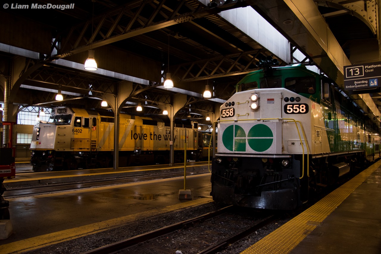 Some of the finest looking and performing GMD passenger units are seen here beside each other at Union Station on a rainy April afternoon. GO 558, built in 1990 has just begun to depart the station for Richmond Hill while VIA 6402, built in 1986 waits patiently for passengers to board before heading east on the Kingston Sub toward either Ottawa or Montreal.