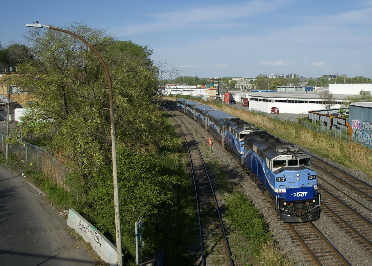 A pair of F59PH's (AMT 1347 & AMT 1342) power EXO 1211 as it passes through Montreal West on the freight track of CN's Montreal Sub.