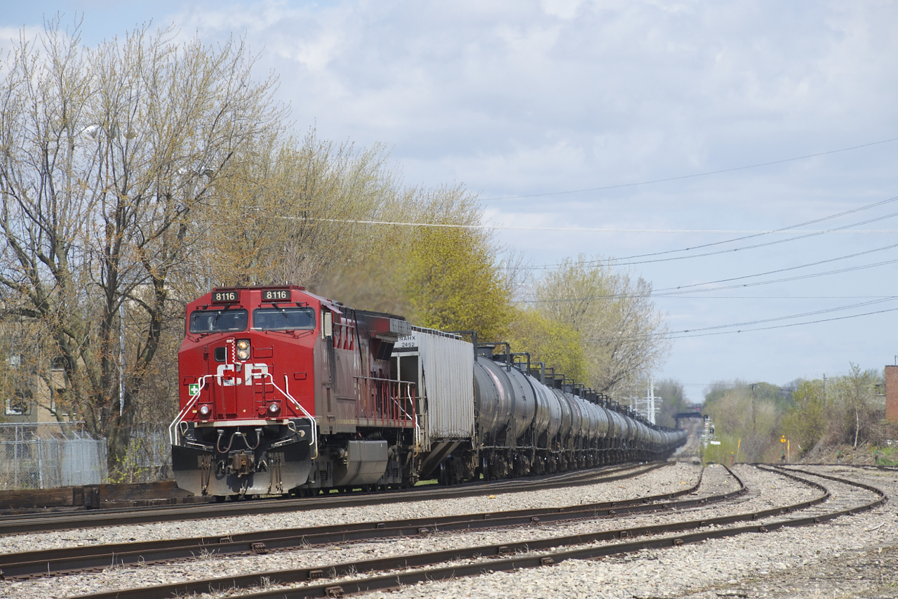 CP 8116 brings up the rear of empty ethanol train CP 651 as it passes the partly ripped up Lasalle Yard.