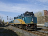 VIA 63 heads west on the south track of CN's Montreal Sub with VIA 6424 at the rear.