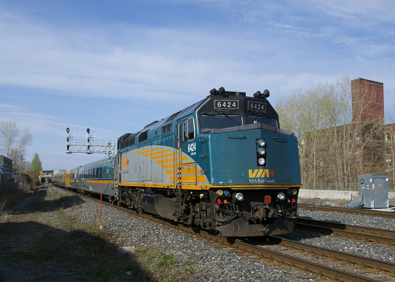 VIA 63 heads west on the south track of CN's Montreal Sub with VIA 6424 at the rear.