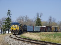 CN 327 is coming off the Kingston Sub and onto the Valleyfield Sub at Coteau, where it will set off some cars before heading south. Leader CSXT 485 has a cut plow for use in the New York City area.