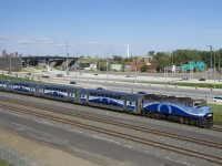 EXO 1211 is approaching the hot box detector at MP 4.8 of CN's Montreal Sub with AMT 1345 and four multilevel cars.
