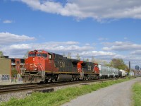 The clouds part just as a 7-car CN 323 passes with two Dash9 variants for power (CN 2507 & CN 2571).