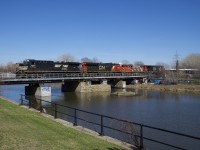 CN 527 has NS 4089, CN 2886, CN 4760 & CN 2687 as it advances over the Lachine Canal with a lift from Pointe St-Charles Yard. 