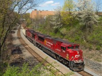 CP 246 makes its way by Main Street in Hamilton with CP 7030 leading the way.  The Strathcona decal adorns the nose on this ACU.