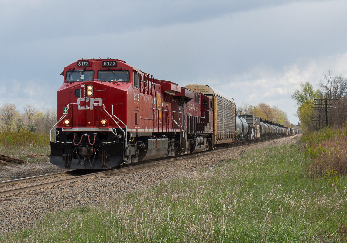 CP 247 charges upgrade at Concession Road 6 behind a fresh AC4400CWM as the skies threatened to open up at any second.