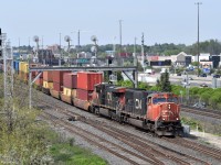 After slowing down to as much as 25 miles per hour while descending the steep grades of the York Subdivision, CN Q108 picks up speed before joining the Kingston Subdivision. The Liverpool searchlights are still standing tall as of this post, despite its future replacements being in place since the end of last year. I thought I had lost my chance by waiting this long to go back there, so I'm glad I was able to get this shot of them in time.