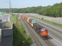 CN 120 has CN 3870, CN 2926 & CN 2961 for power and a 582-axle long train as it passes under a large signal bridge