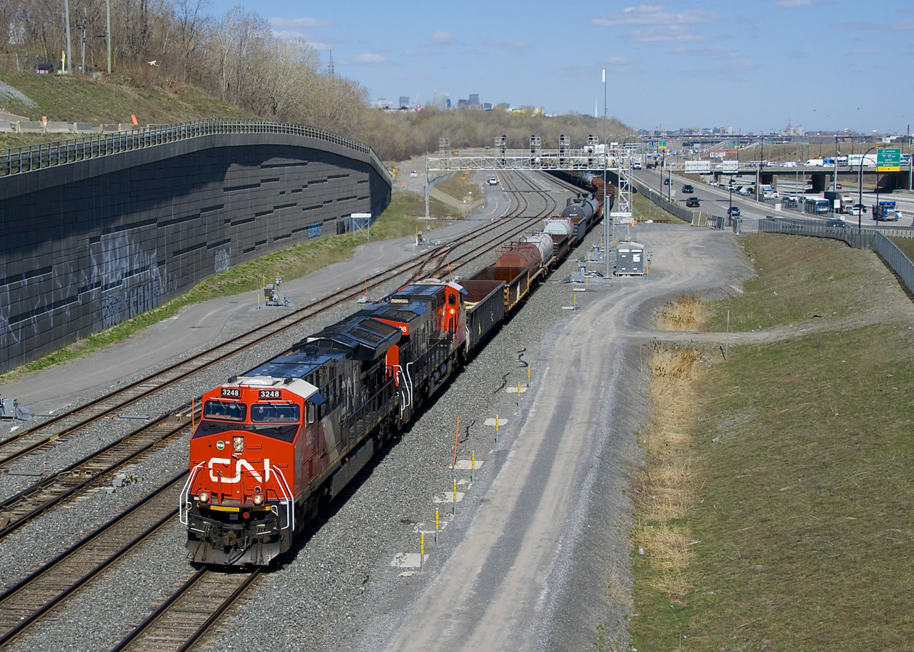 CN 3248 & CN 3898 lead a 112-car CN 321 by Turcot Ouest. Both units feature white cab roofs, a feature found on CN's most recent GEVO's.
