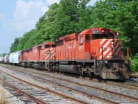 On a day that started at Bathurst St. in Toronto to watch the morning GO rush, late morning we relocated to CP Guelph Jct.  CP 421 came along mid-afternoon with a consist that even in 2010 was pretty rare.  Despite all the driving I'm glad we had to good sense to chase it to Woodstock.  After a brief delay waiting for OSR to clear, CP 421 is shown at Oxford St. continuing on their way west.  It was a very hot day so the crew wisely had the front door open to get a breeze in the cab.  And check out that polished brass bell on 9004!  It sure beats a pair of GEs.    