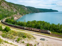 Dubbed the "Superior Flyer", 29B-13 skirts the shores of Lake Superior past the old pit at Cavers. Just ahead of them lies the siding at Gravel, where the power will cut off, run around the train and return to Schreiber. <br><br>This was the second of a number of excursions celebrating the 125th Anniversary of Canadian Pacific that took part over three days. The first operated east out of Thunder Bay to Hurkett and return. The following day they deadheaded the consist over to Schreiber for this evening run to Gravel and return. Over the course of the next two days they would operate an excursion east out of Schreiber to Coldwell in the morning and west to Gravel in the evening.