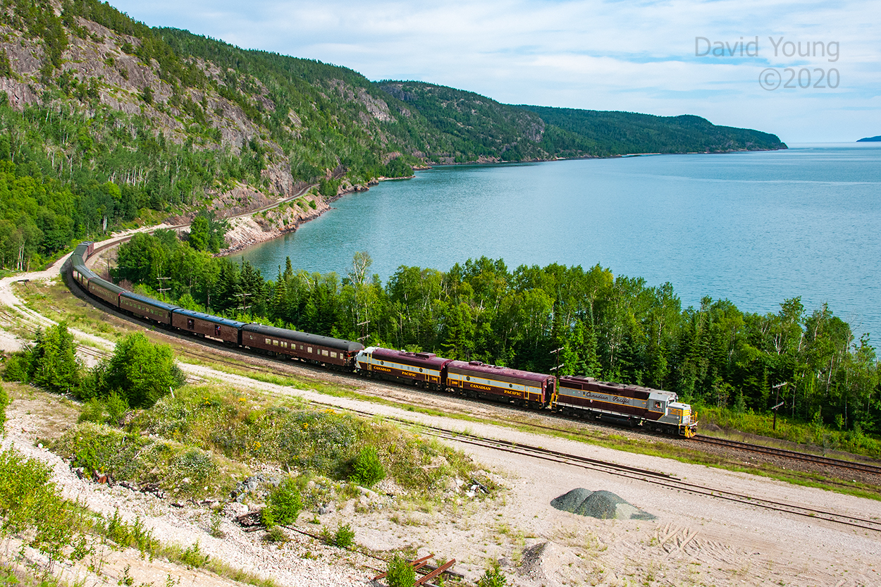 Dubbed the "Superior Flyer", 29B-13 skirts the shores of Lake Superior past the old pit at Cavers. Just ahead of them lies the siding at Gravel, where the power will cut off, run around the train and return to Schreiber. This was the second of a number of excursions celebrating the 125th Anniversary of Canadian Pacific that took part over three days. The first operated east out of Thunder Bay to Hurkett and return. The following day they deadheaded the consist over to Schreiber for this evening run to Gravel and return. Over the course of the next two days they would operate an excursion east out of Schreiber to Coldwell in the morning and west to Gravel in the evening.