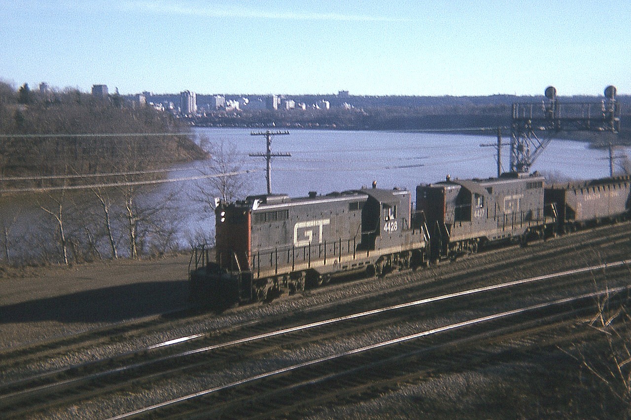 Rather rough old image. GT 4428 and 4427, a pair of early GP9s; already 20 years old when this photo was taken, power a ballast train eastward toward Aldershot from Hamilton. The locos were previously numbered 1752 and 1751.