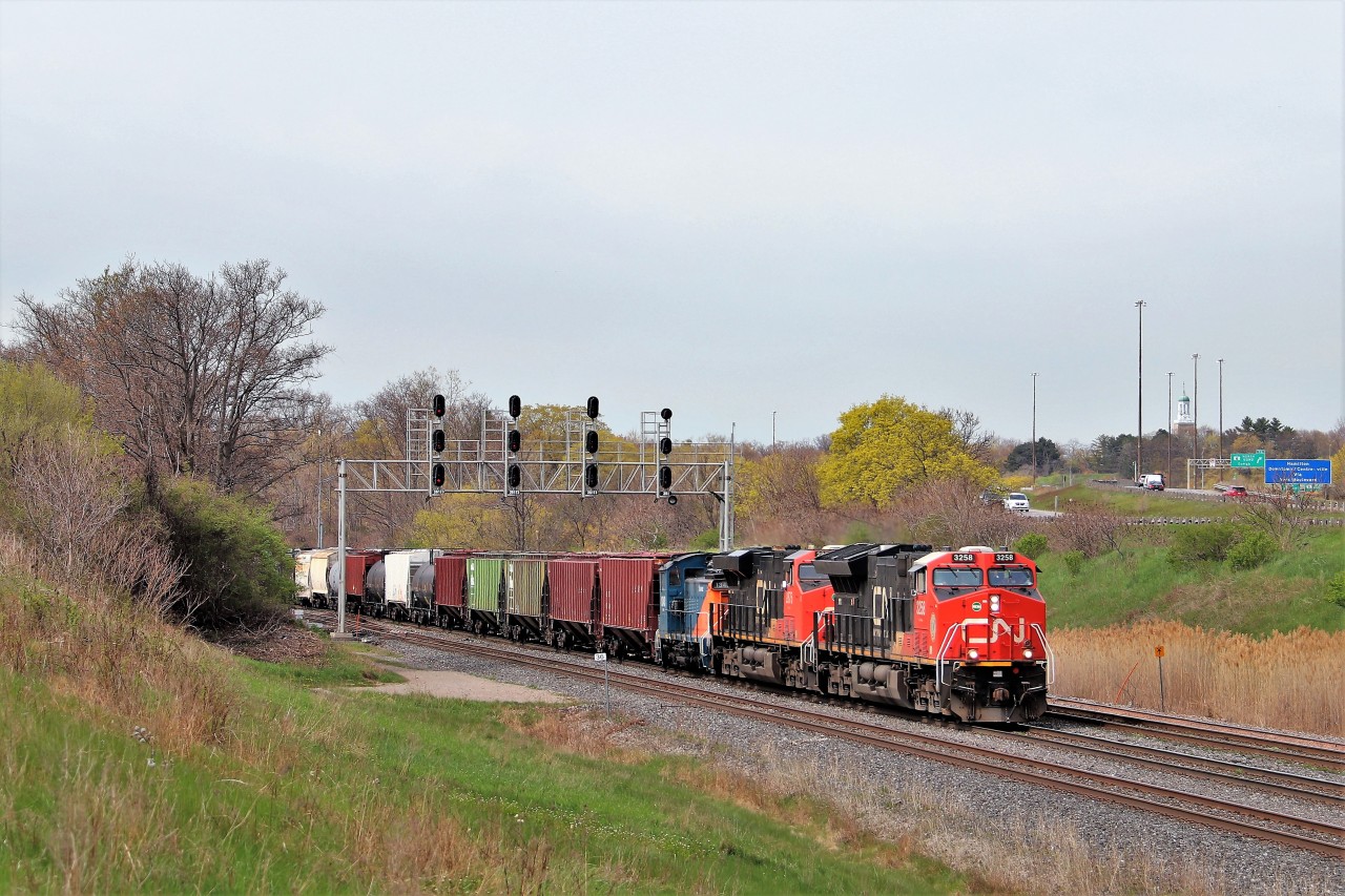 CN 396 drew quite a bit of attention with Savage SVGX 1343 hitching a ride north to the place where it began as CN 1343. We waited for some time and the sun faded beneath the approaching clouds but the wait was worth it. CN 3258 with CN 2875 provide the power as the trio makes the approach to Aldershot as they run along side the 403.